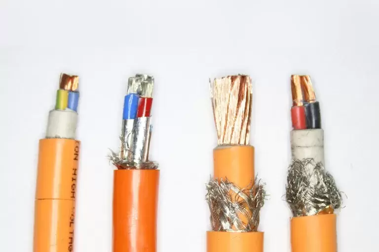 Three wires orange, yellow with silver wire inside it.